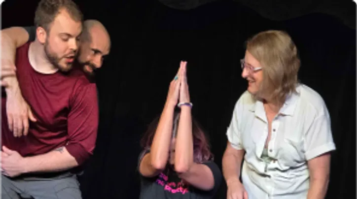 Four silly improvisers having fun on stage.